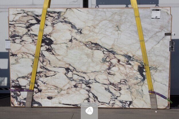 Antolini Calacatta Viola Top marble slab with cream ground and dramatic dark violet diagonal veining