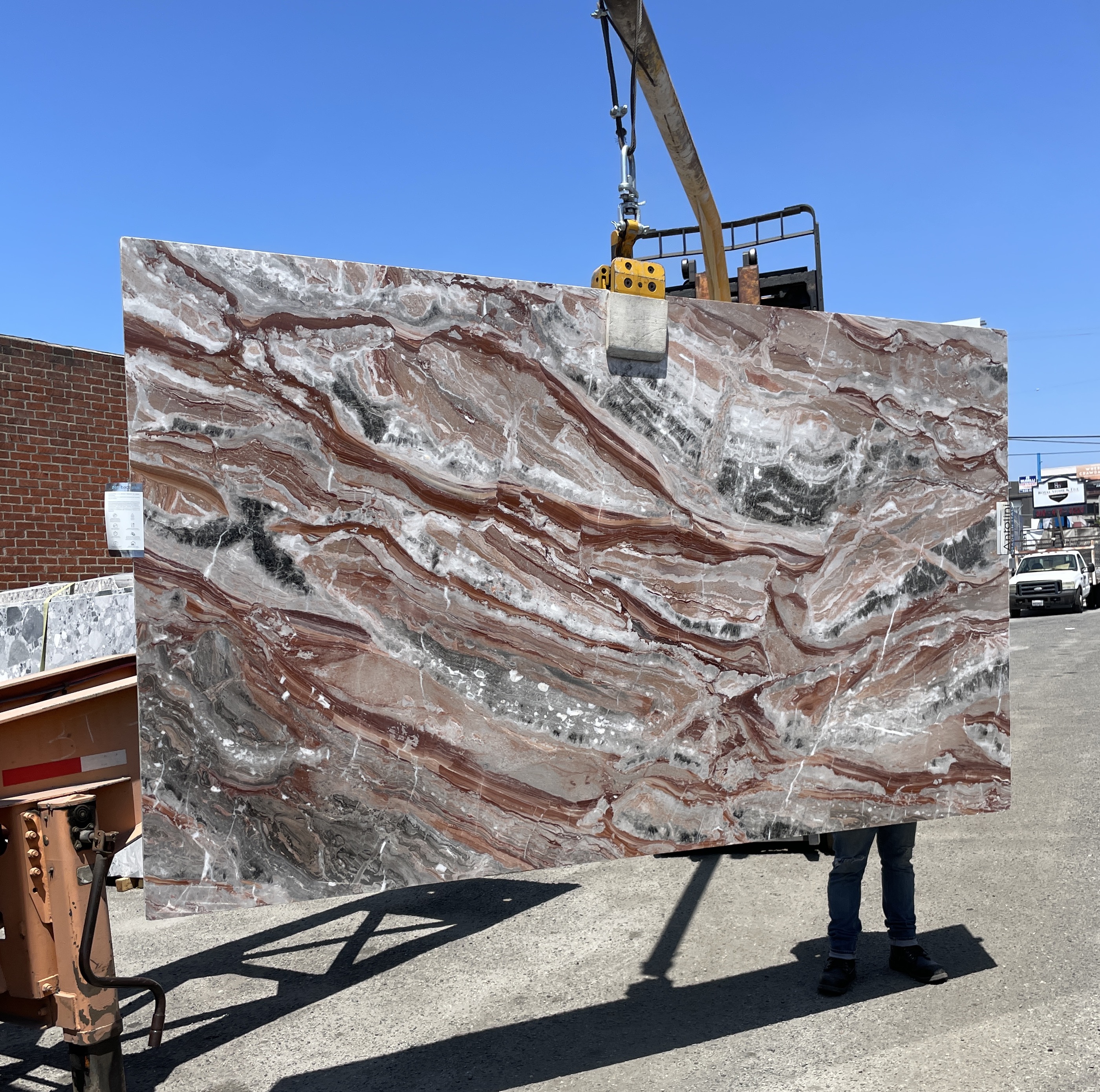 Antolini Viola Orobico polished Italian marble slab at Royal Stone Los Angeles — rust-red, plum and silver-grey currents