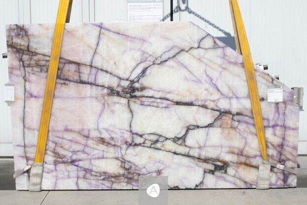 Antolini Cristallo Trasviolet quartzite slab, AVP-treated, with translucent white field and violet and gold veining