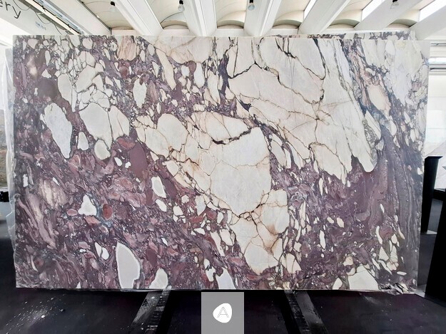 Antolini Calacatta Viola Top marble slab with violet, plum, and white field crossed by oxblood veining